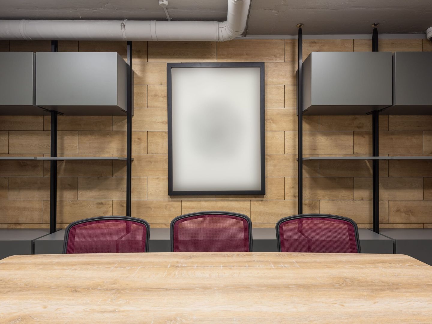 An empty boardroom with a long table