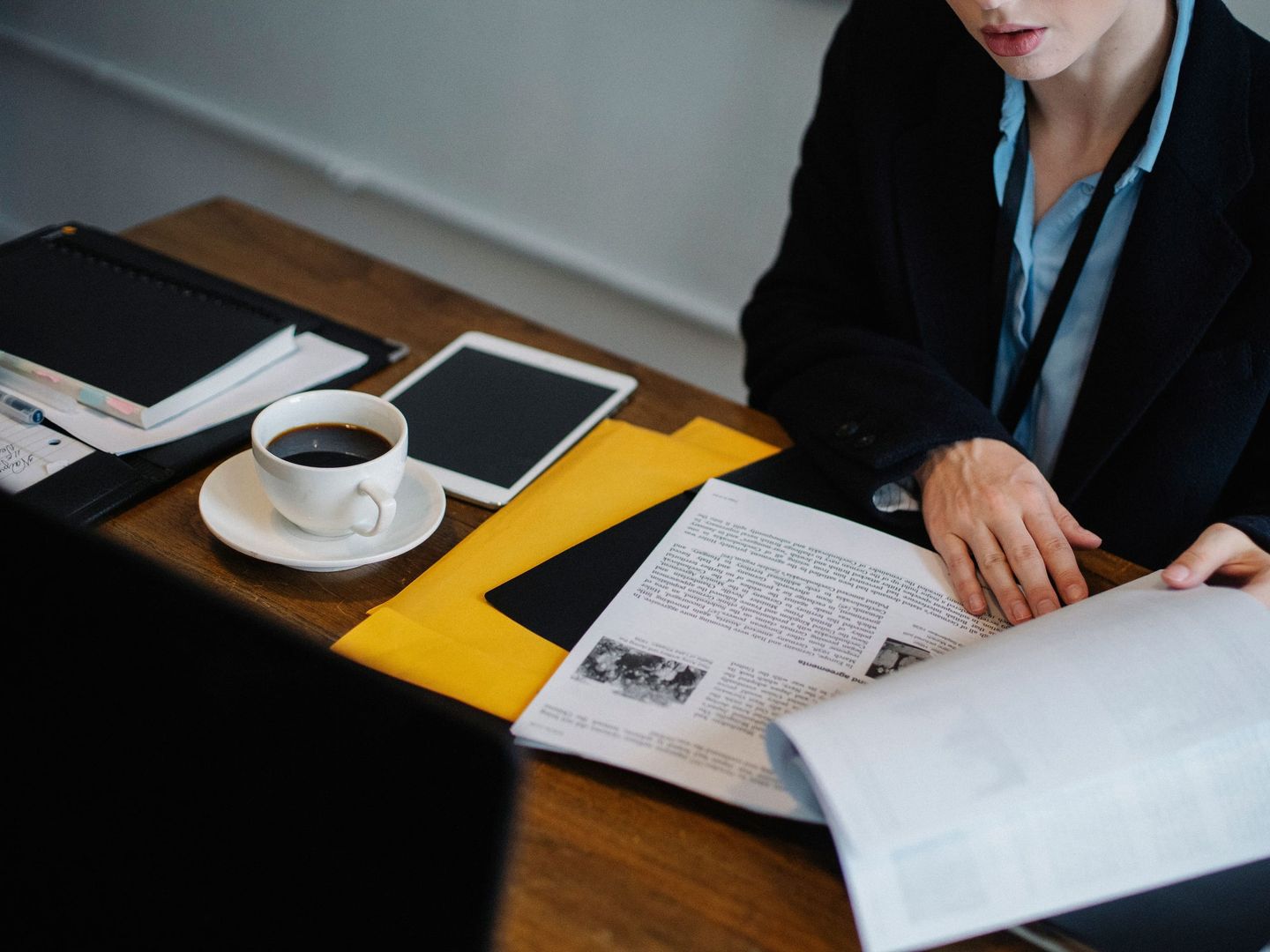 A compliance officer working through a file