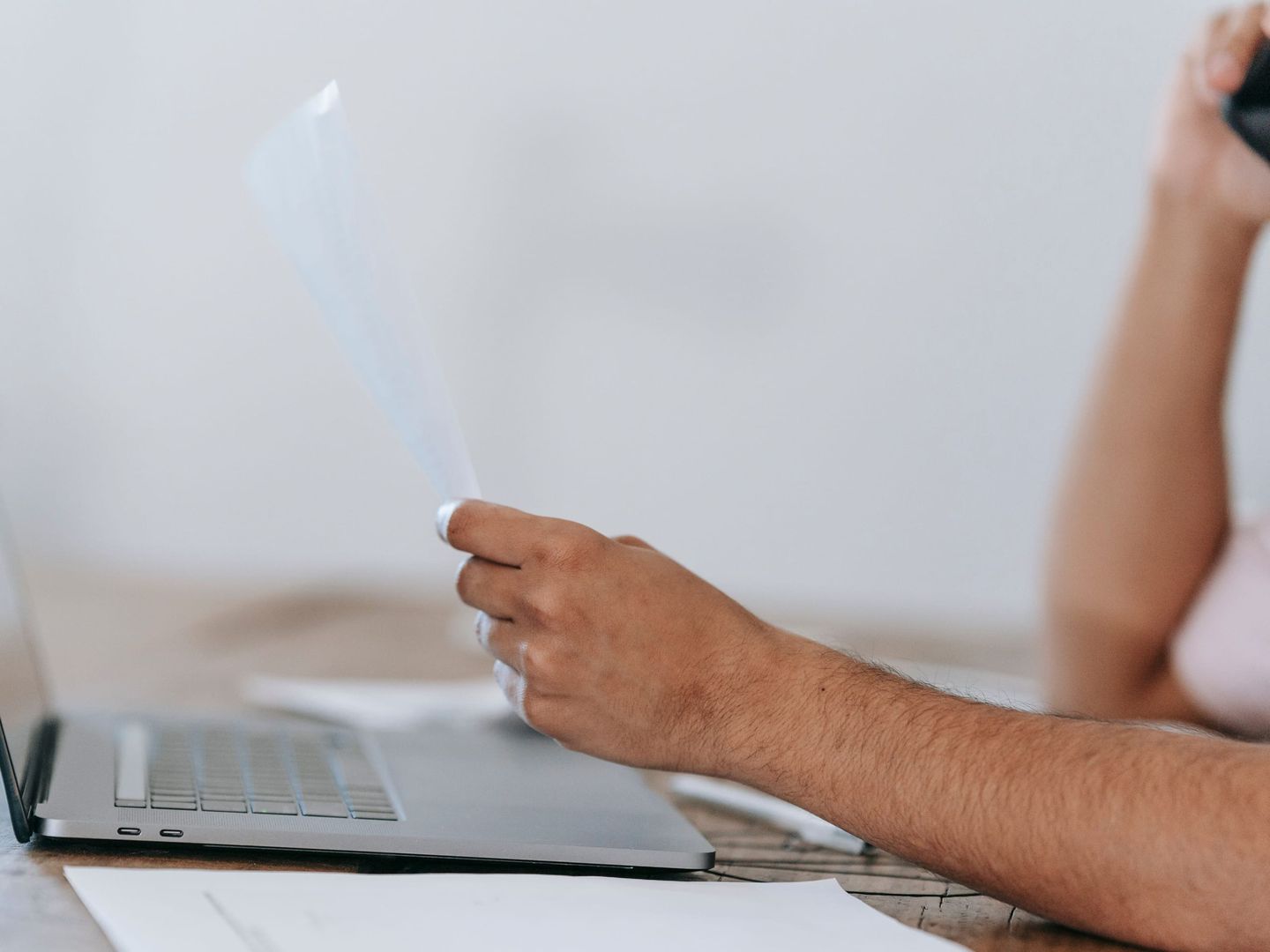A consultant sending an invoice from a laptop