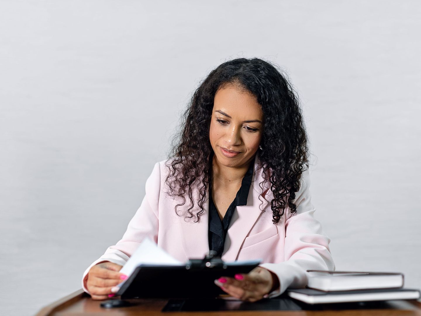 A business owner reading a letter at a desk