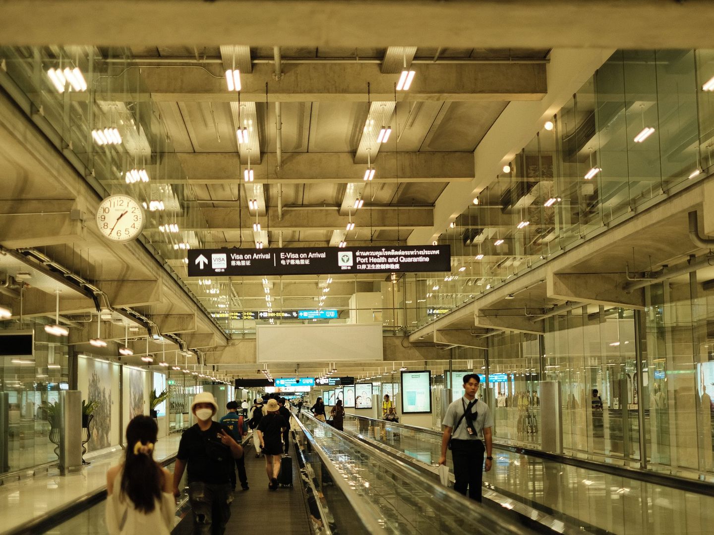 A family arriving at an airport with luggage