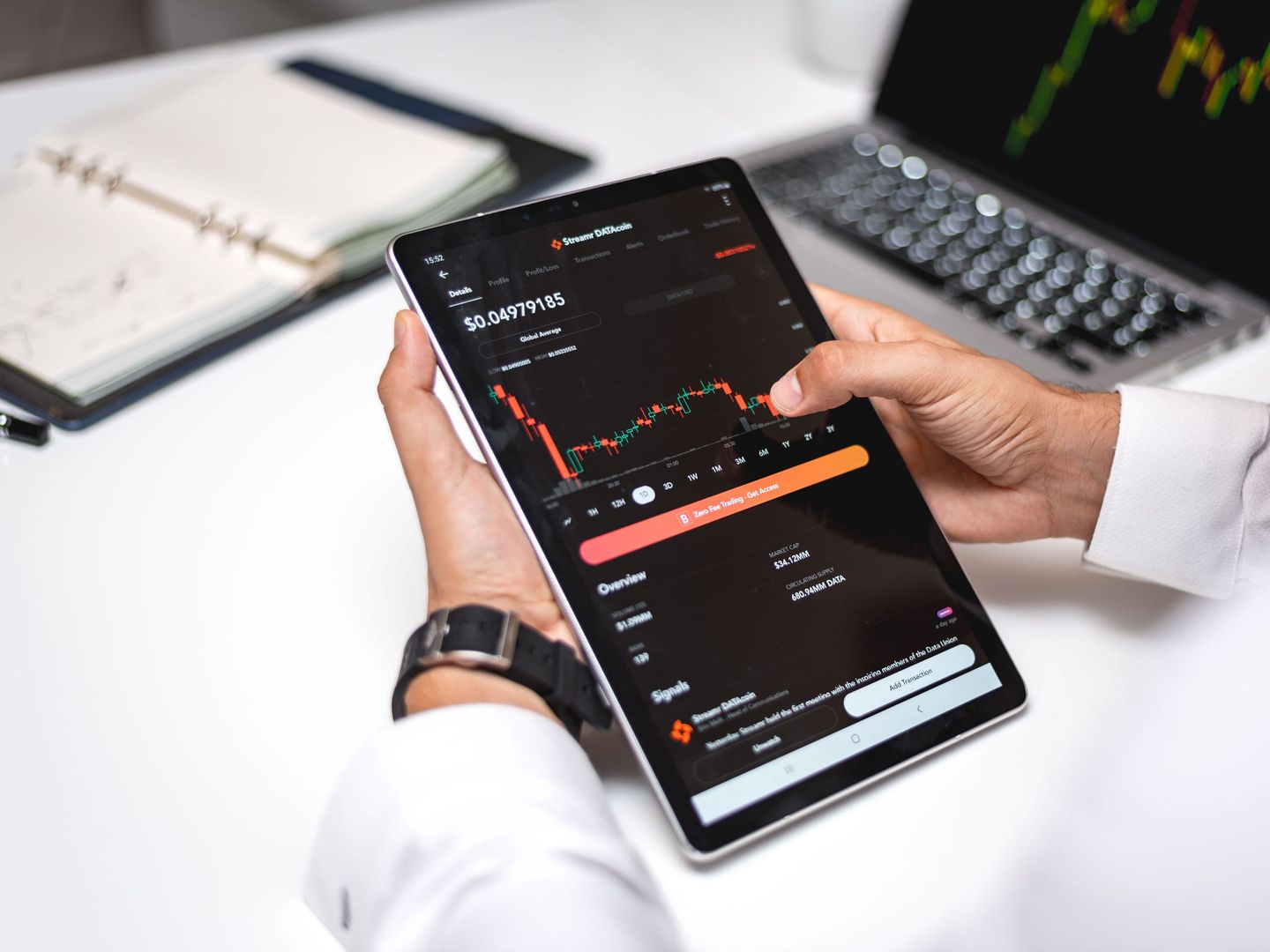 A developer at trading screens in a crypto office