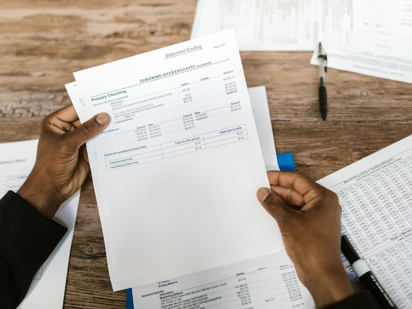 A finance manager working through a payment schedule